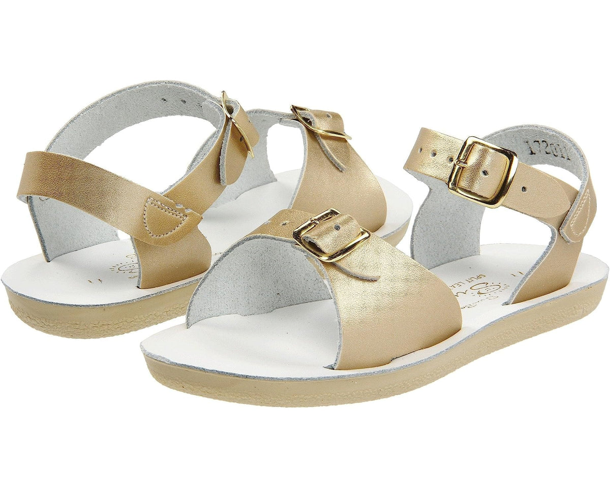 Double strap, rubber sole, leather surfer sandal by Saltwater Sandals in gold for children sizes five through twelve.