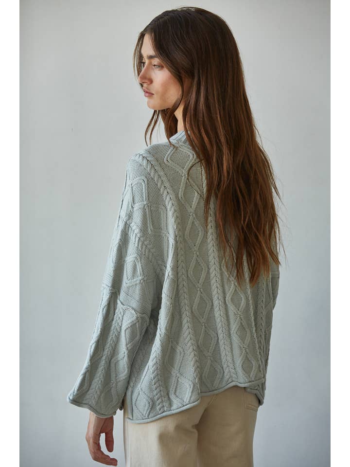 cable knit light blue sweater with side slits