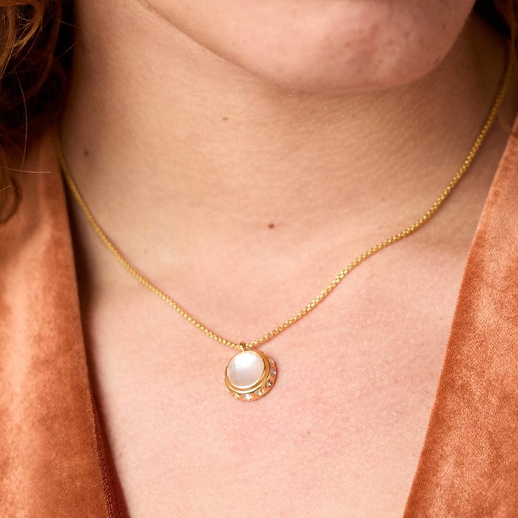thin chain gold necklace with white stone