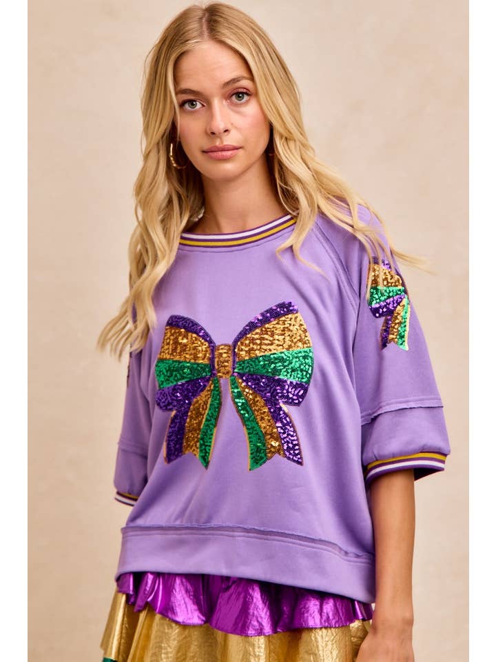 purple sweatshirt with sequin mardi gras bow