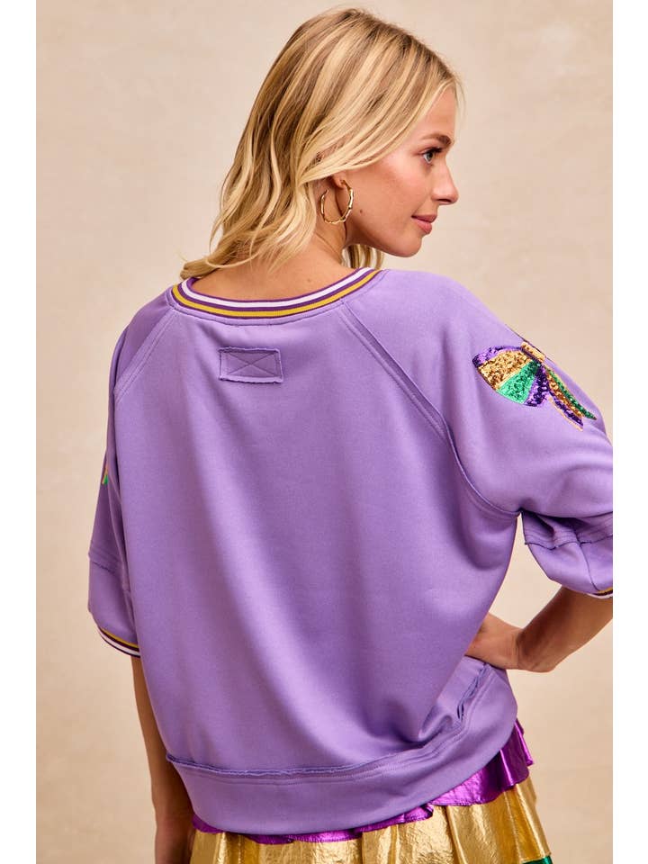 purple sweatshirt with sequin bow
