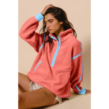 pink sherpa fleece pullover with blue accents