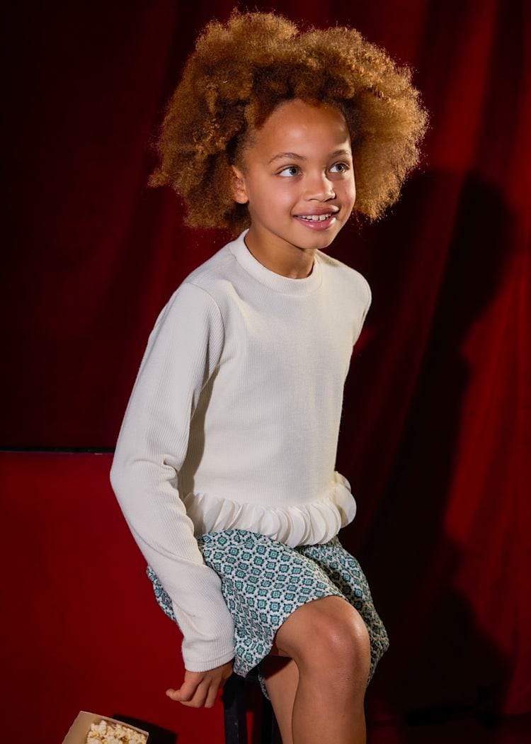 cream long sleeve top with petals