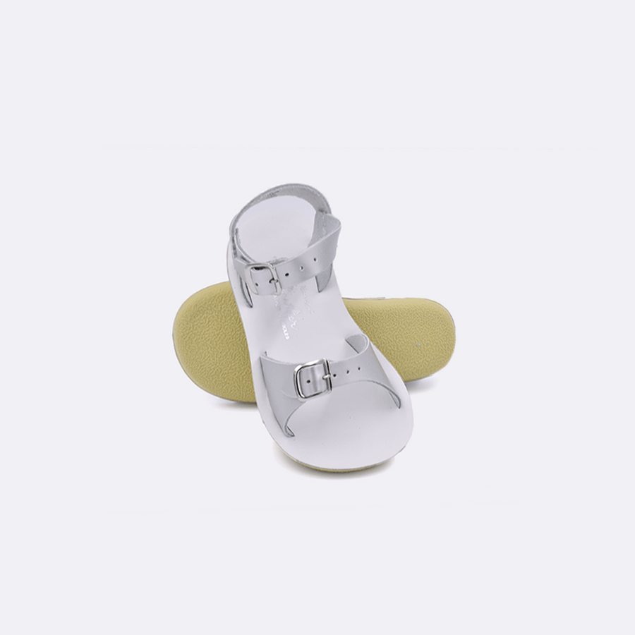 Double strap, rubber sole, leather surfer sandal by Saltwater Sandals in silver for children sizes five through twelve.