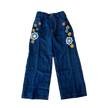 Blue denim pants with floral patches 