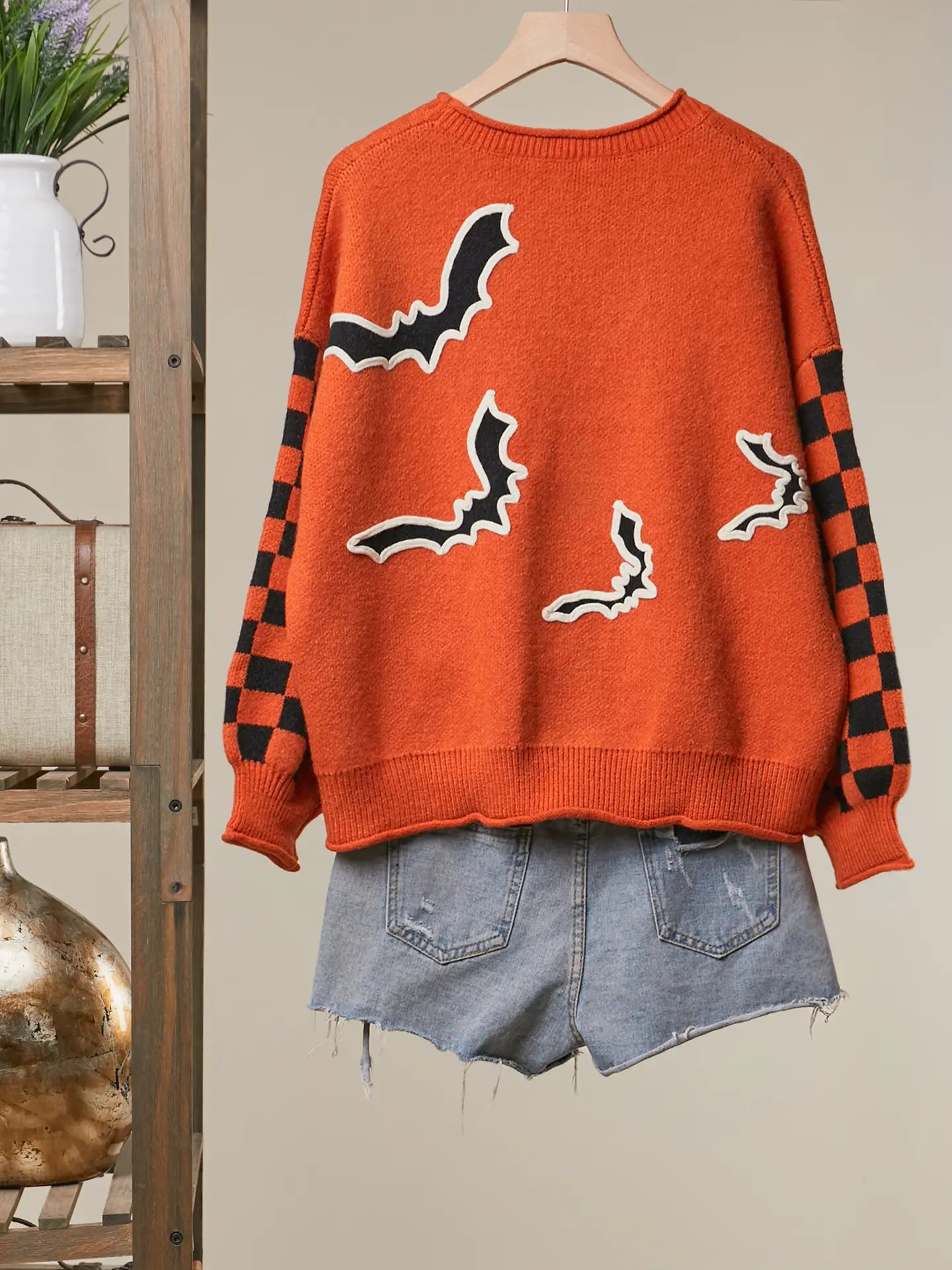 Checkerboard Sleeve Bats Sweater