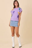 Main Strip Mardi Gras Bow Knit Top