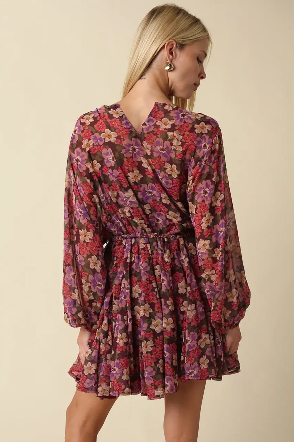 Back view of Emily floral balloon sleeve mini dress with V-shaped back