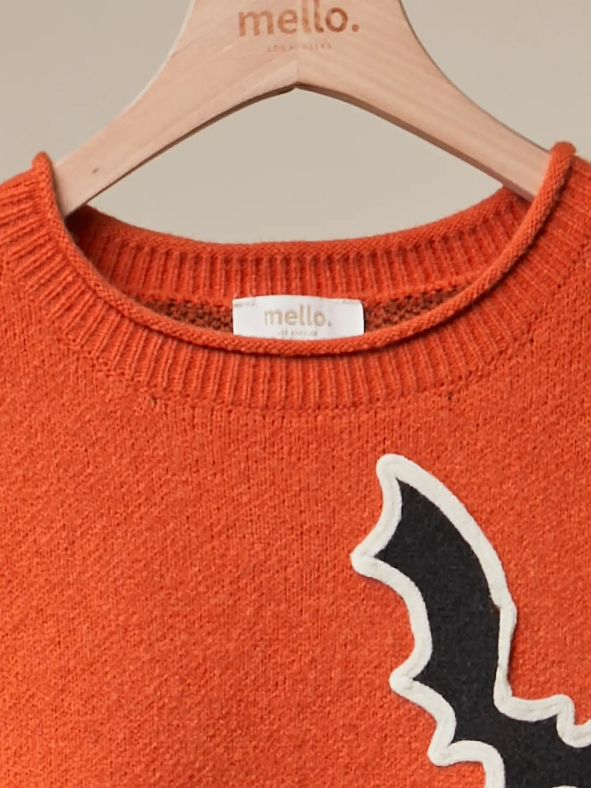 Checkerboard Sleeve Bats Sweater