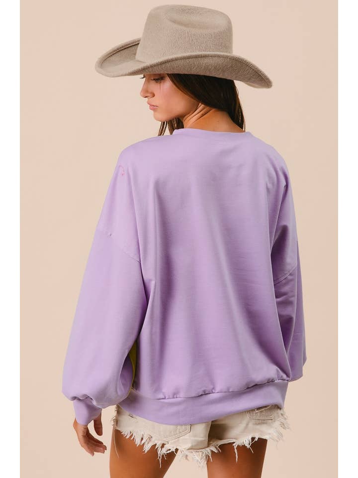 over sized stripe mardi gras pull over in purple