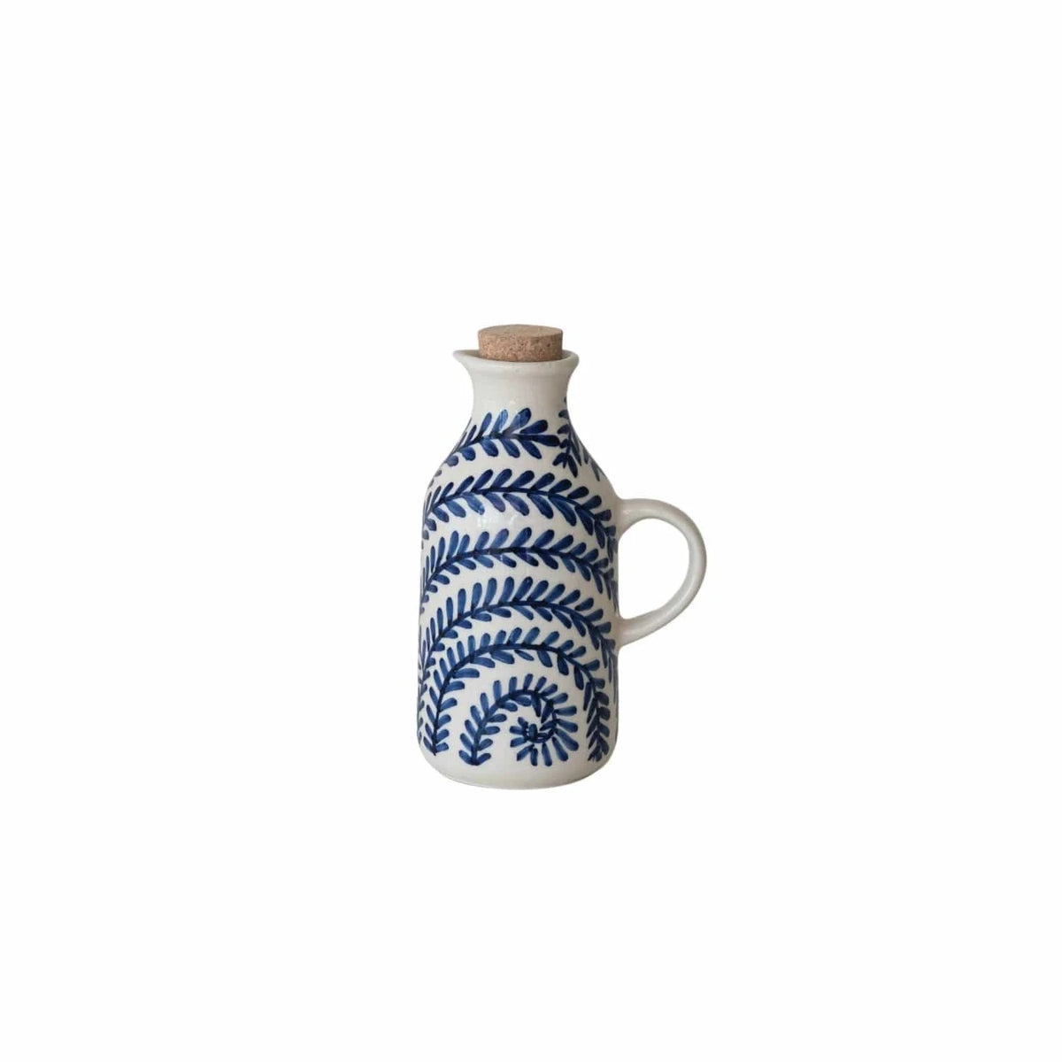 White ceramic oil dispenser with blue leaf pattern and cork lid