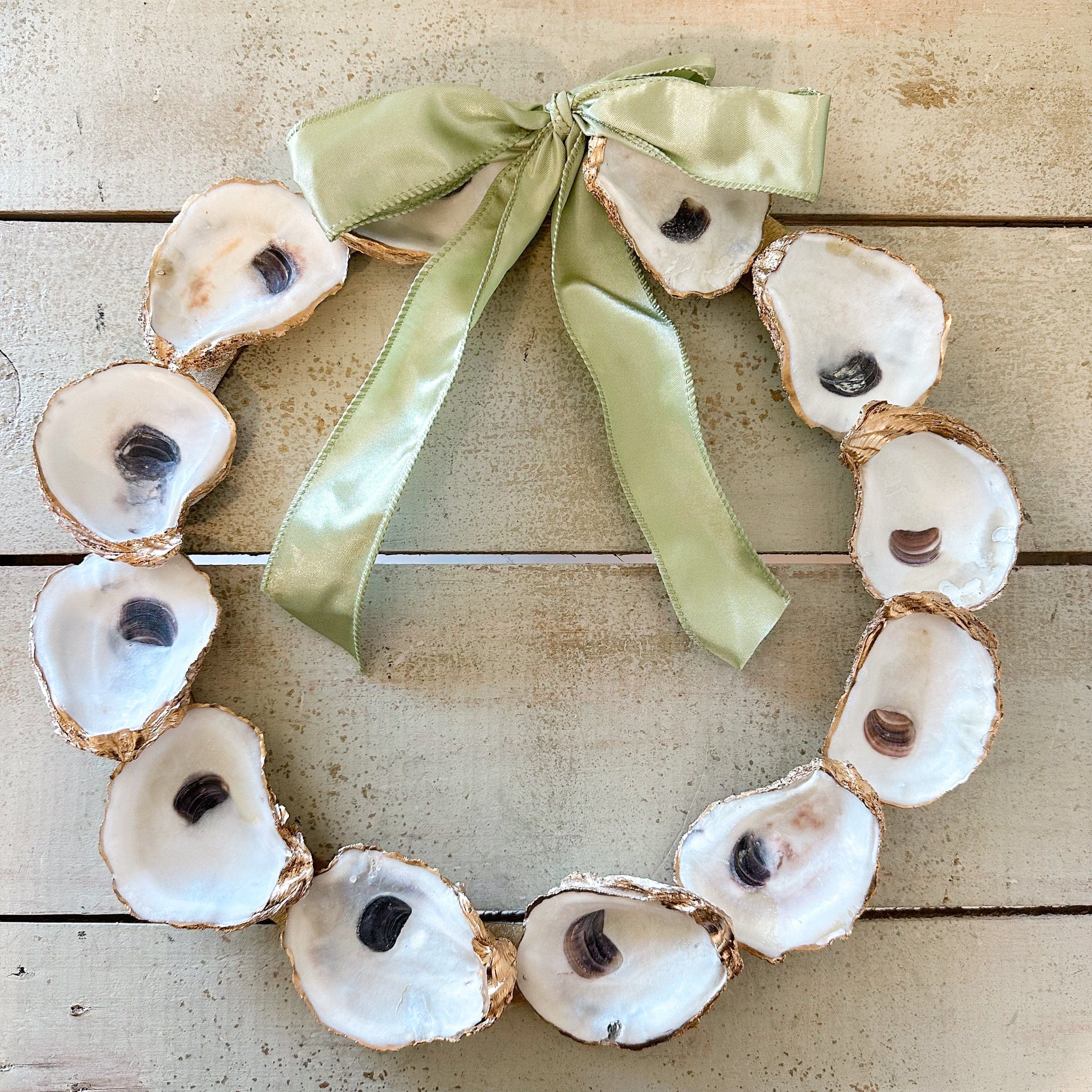 oyster wreath with green ribbon