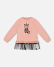 pink long sleeve top with tulle and a cat
