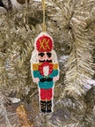 red and gold hat nutcracker ornament