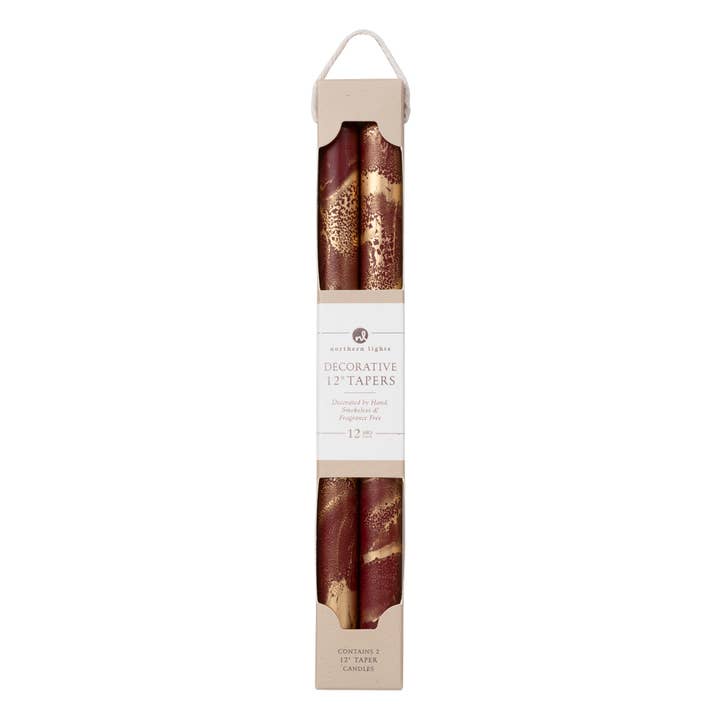 red and gold tapered decorative candles