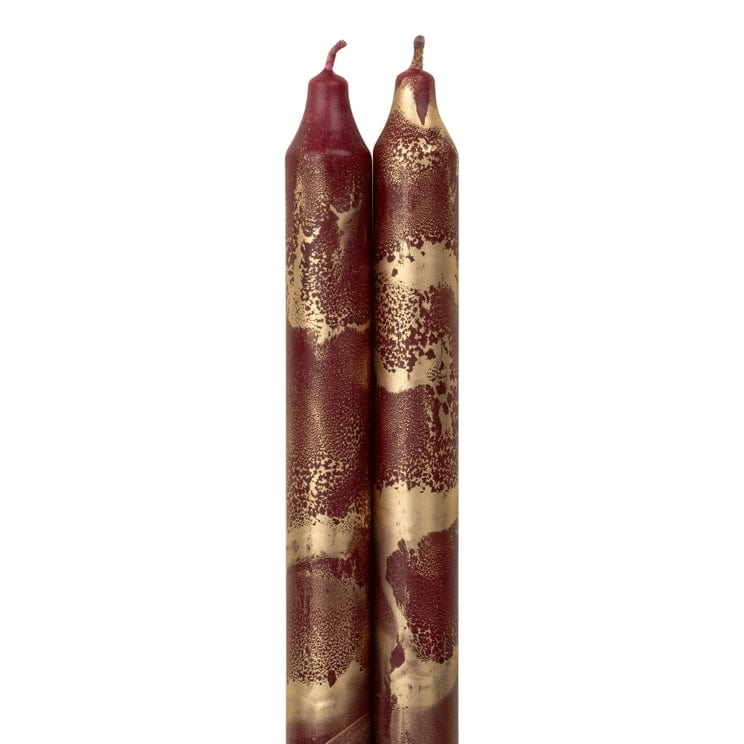 red and gold tapered decorative candles