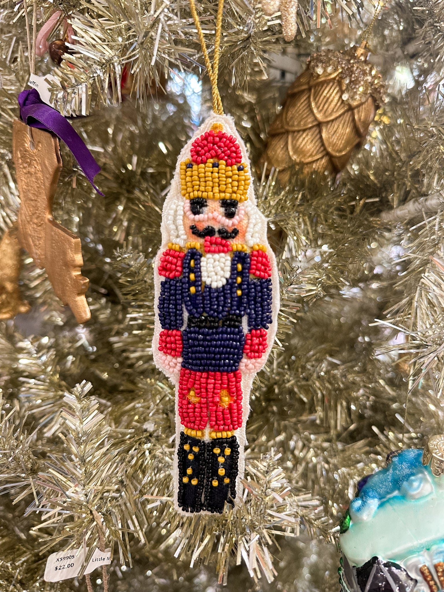red gold crown nutcracker ornament