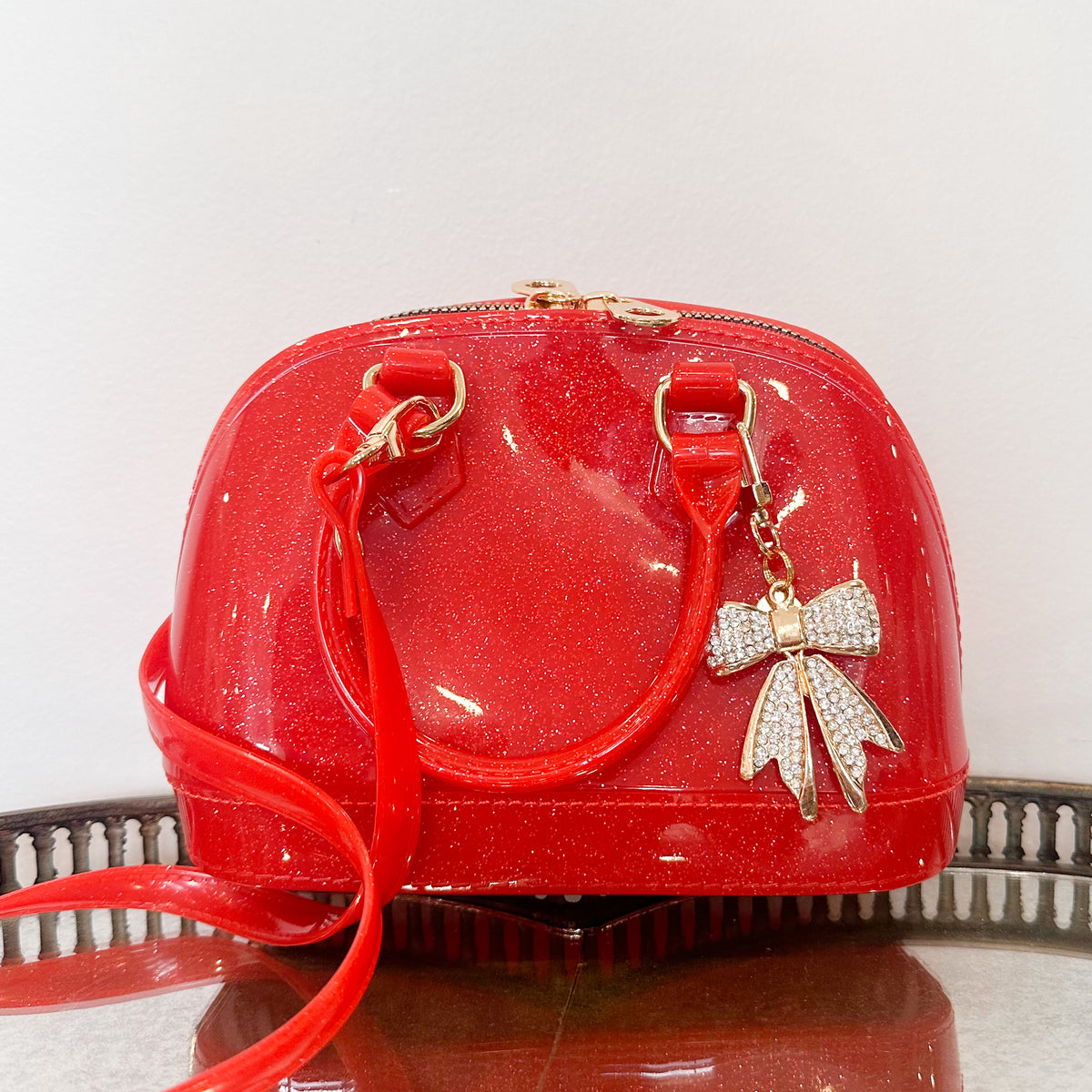 girls red sparkle purse with gold bow charm