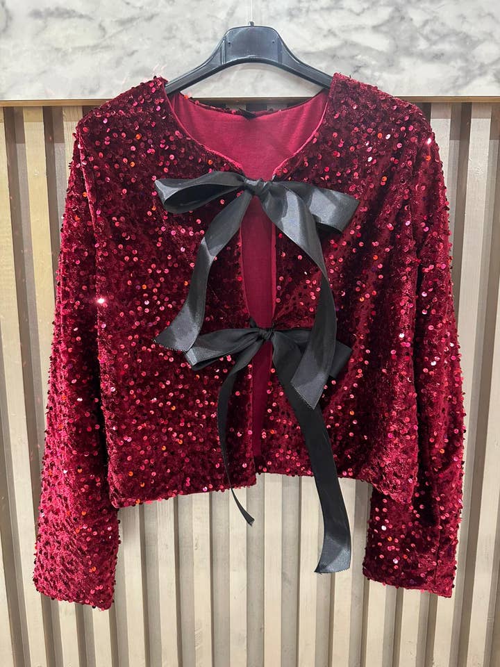 red sequin cardigan with bows