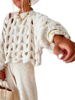 white crochet sweater over lay
