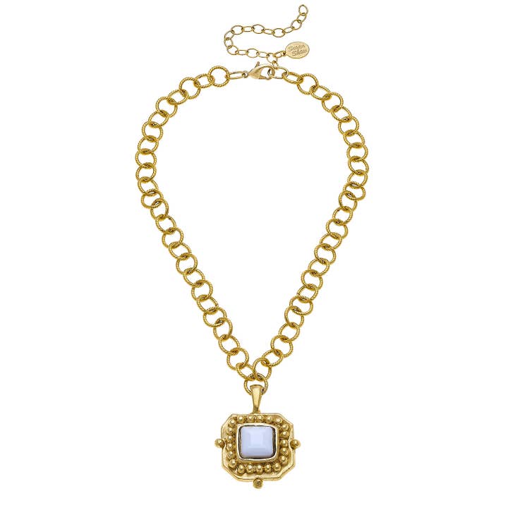gold necklace with white crystal pendant