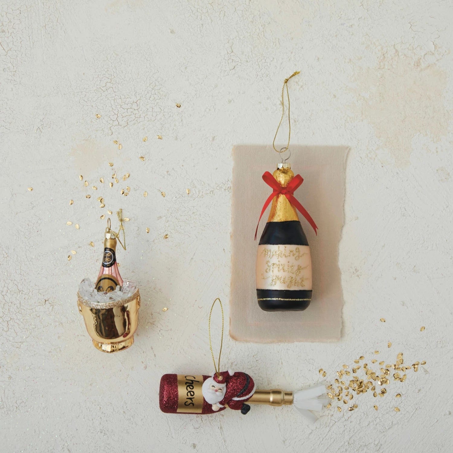 Creative Co-op Creative Co-op 2.25"L x 5.75"H Glass Champagne Bottle Ornament with Resin Santa & Glitter - Little Miss Muffin Children & Home